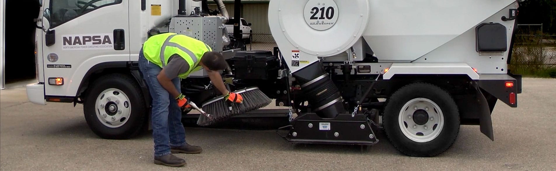 Street Sweeping Truck Operator - Sweeping a Construction Site